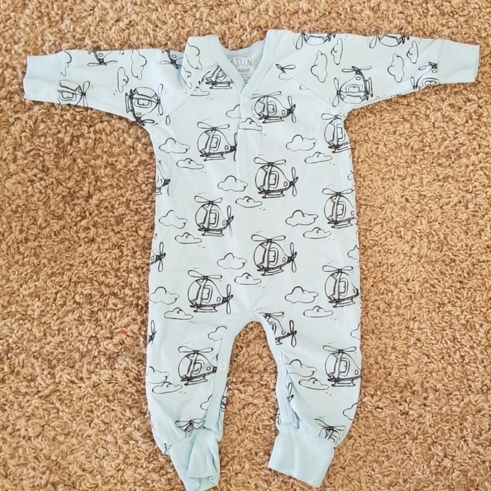 Light blue romper with helicopters